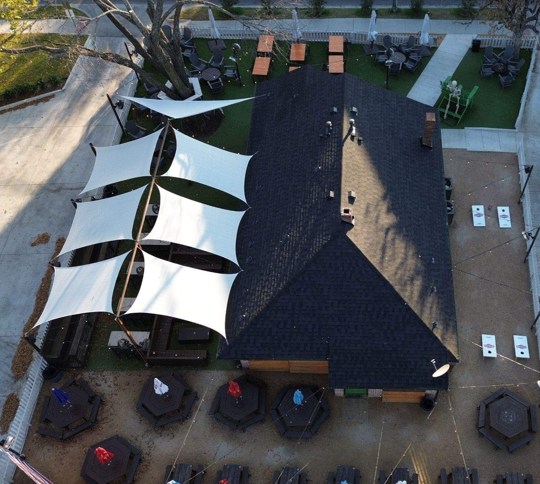 An aerial view of a restaurant with tables and umbrellas