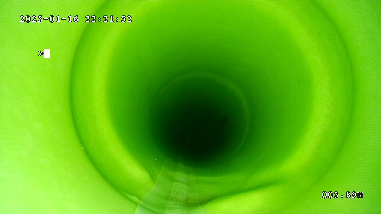 The inside of a green pipe is shown in a video.