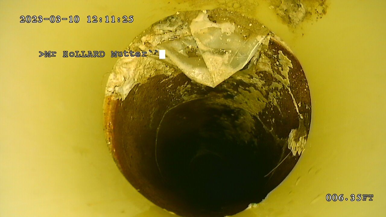 A close-up of a hole in a drain before pipe relining by Steyn's Plumbing in Lynnwood, Pretoria.