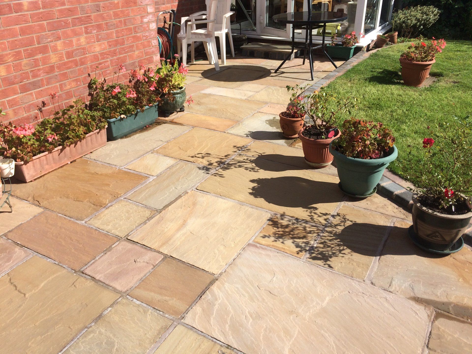 Indian stone patio with decorative edgings in Shrewsbury