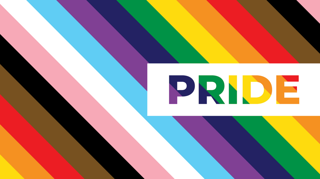 A rainbow striped background with the word pride in a white box.