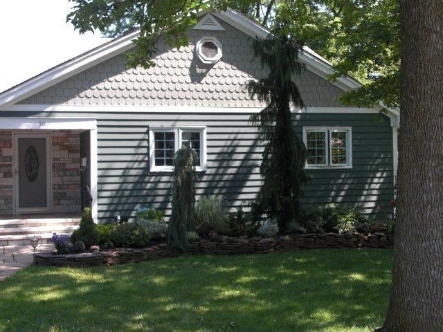 A house with a tree in front of it