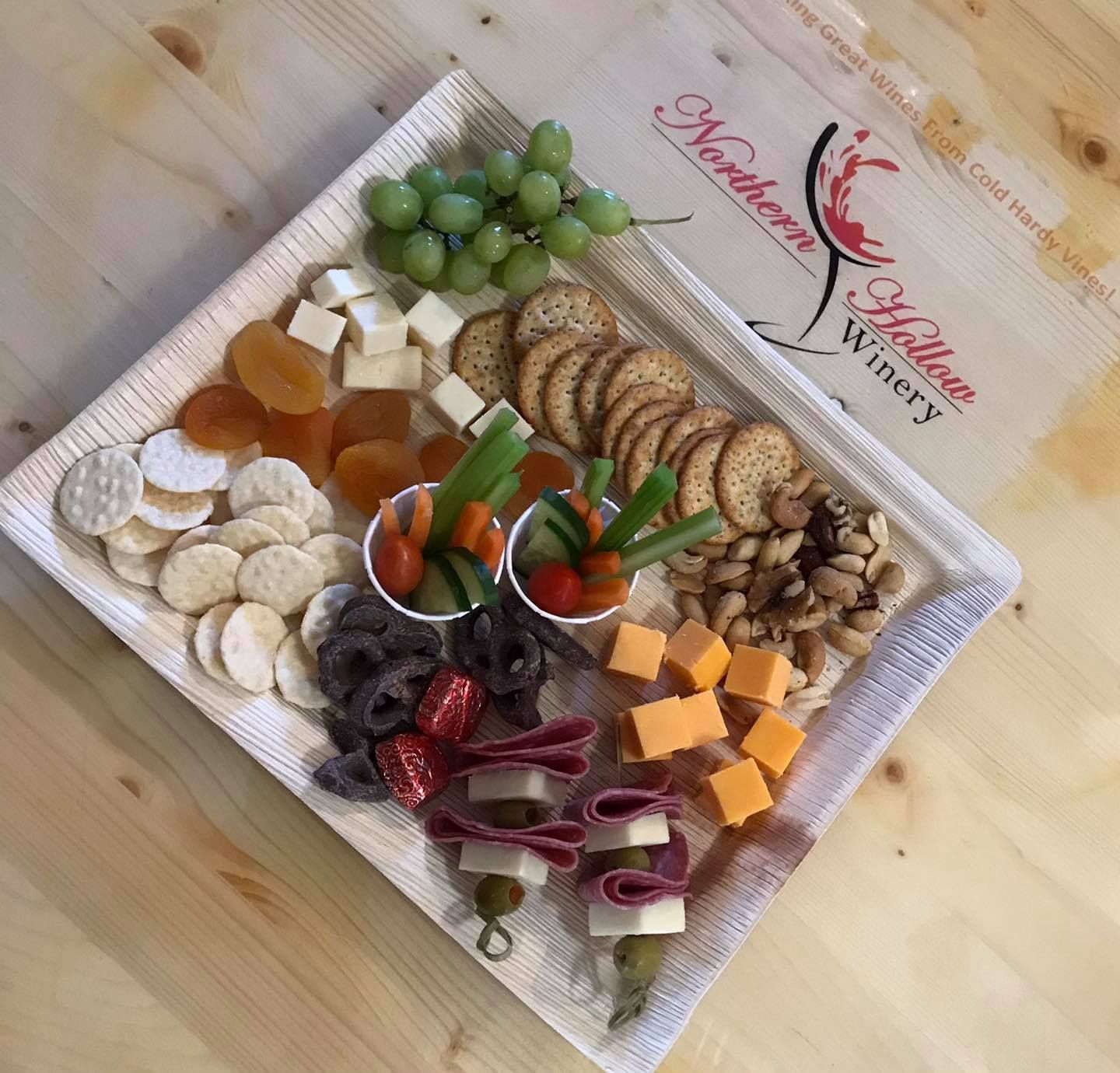A northern hills winery tray of food on a wooden table