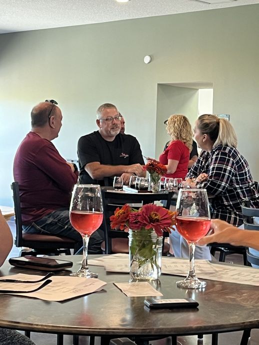 A bunch of bottles of wine are sitting on a table