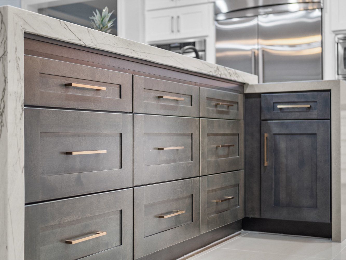 Brass door handles with brown rustic shaker cabinets in kitchen remodel in Aliso Viejo, CA