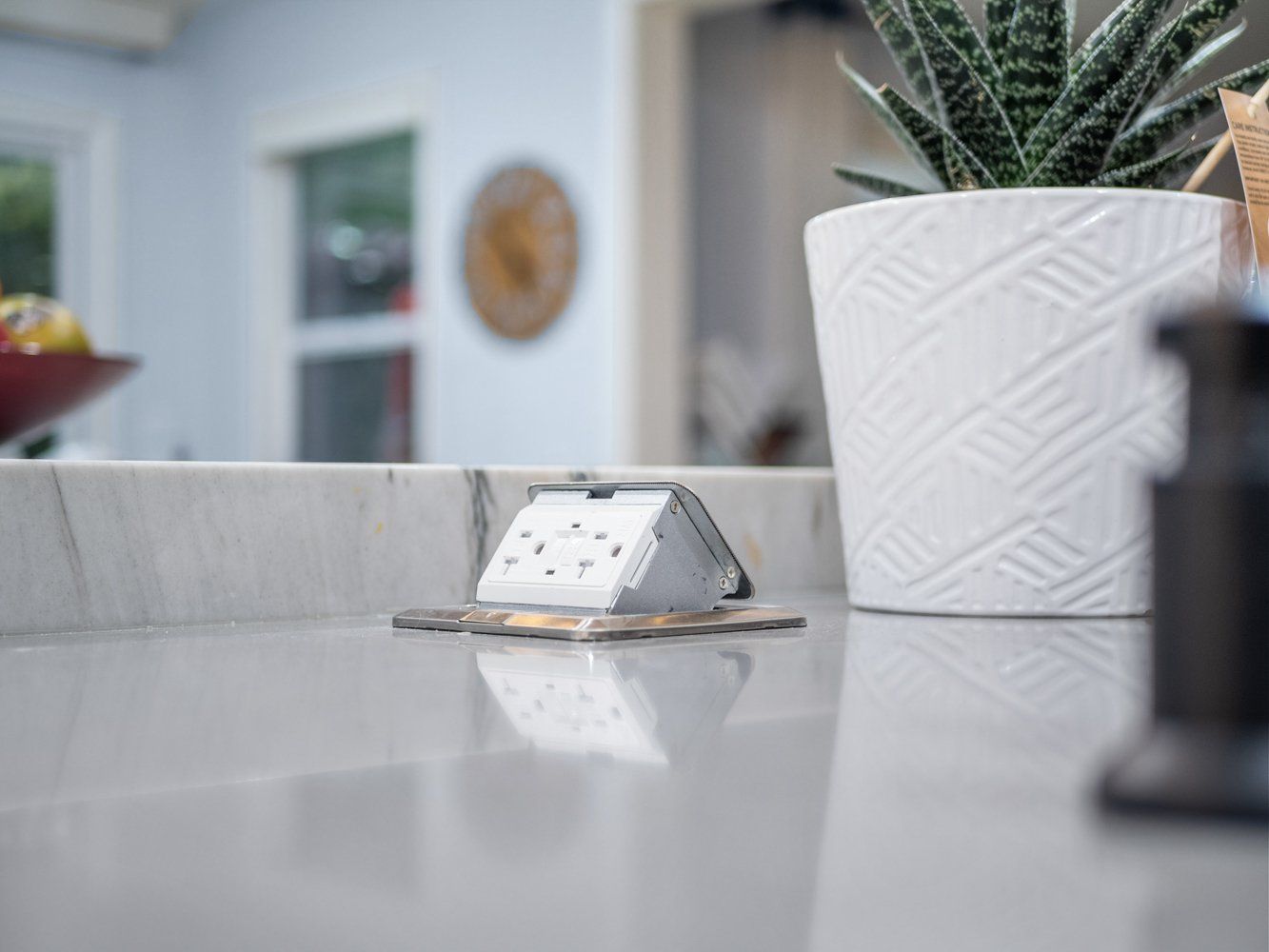 Retractable power outlet on kitchen island remodel in Aliso Viejo, CA