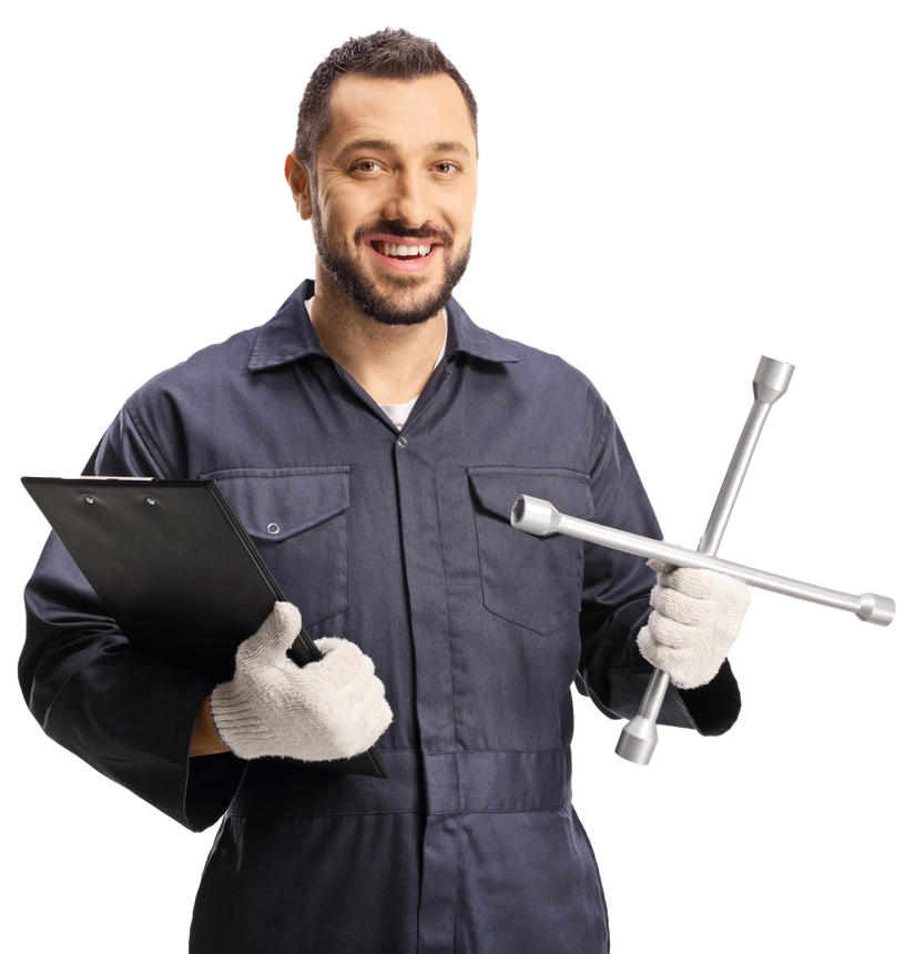 A man in a blue jumpsuit is holding a wrench and a clipboard.