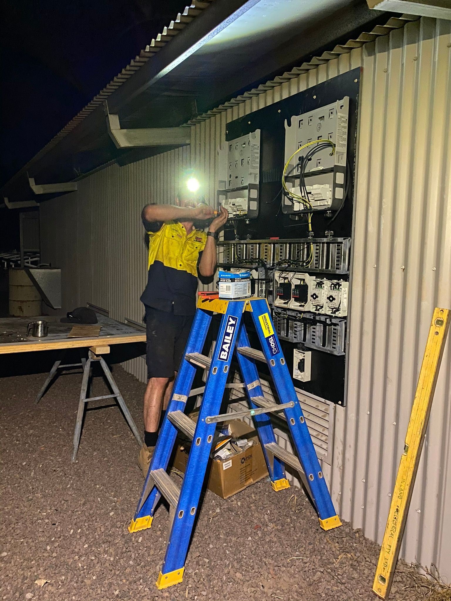 Person Fixing A Power Board— Inland Electrical in Humpty Doo, NT