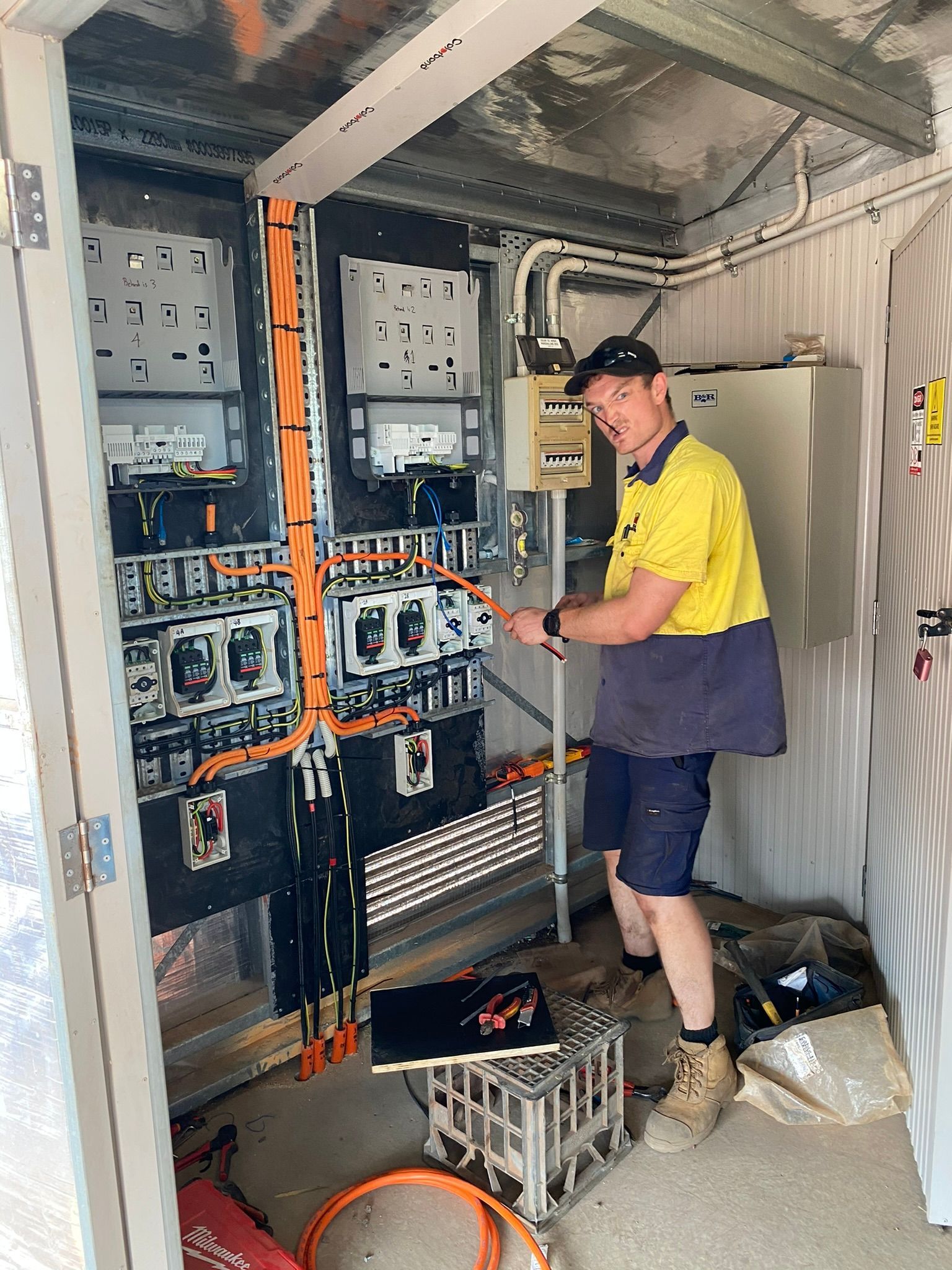 Electrician Working On Wires— Inland Electrical in Humpty Doo, NT