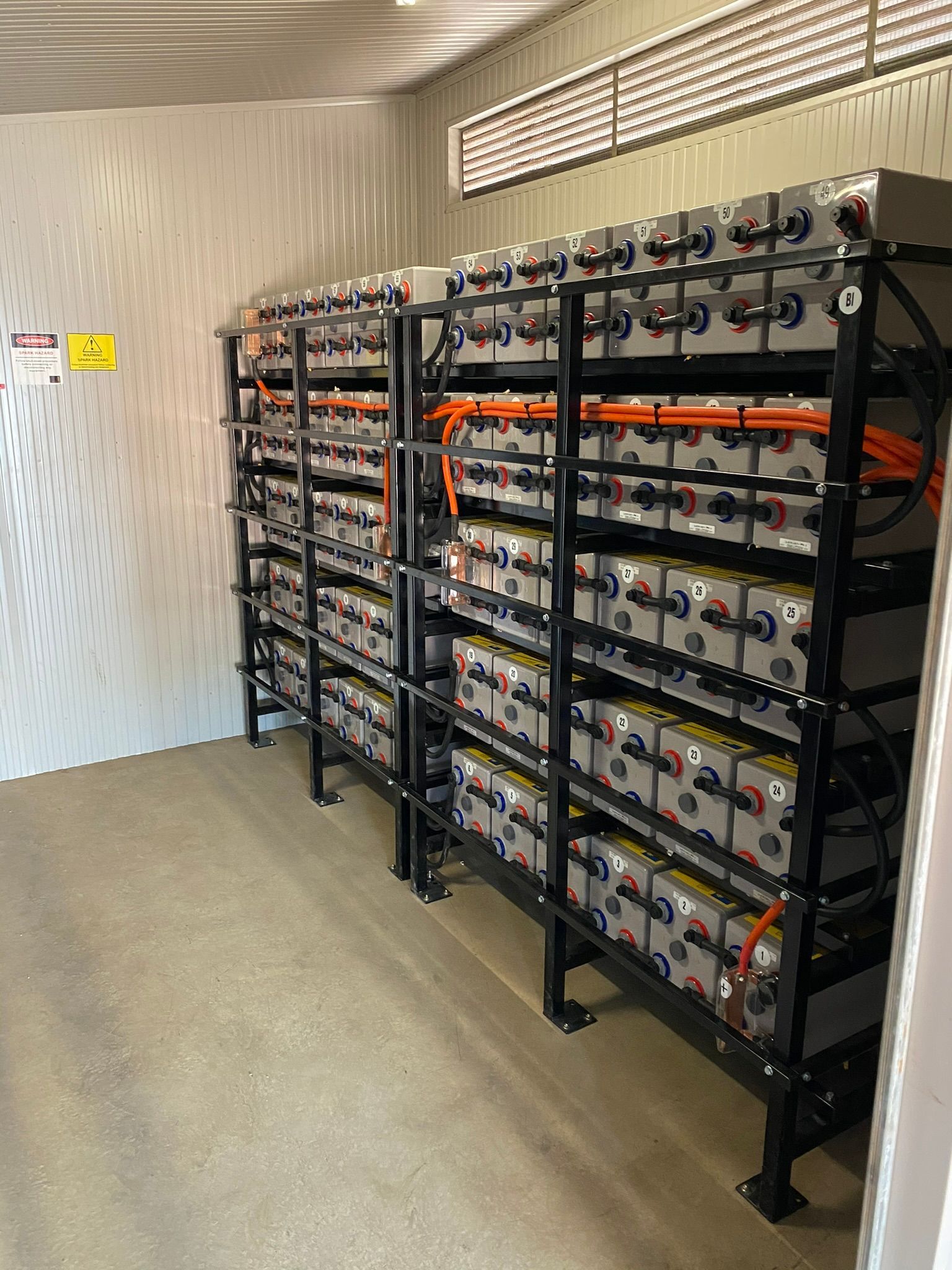 Rows of Batteries With Red and Black Terminals, Indoors — Inland Electrical in Humpty Doo, NT