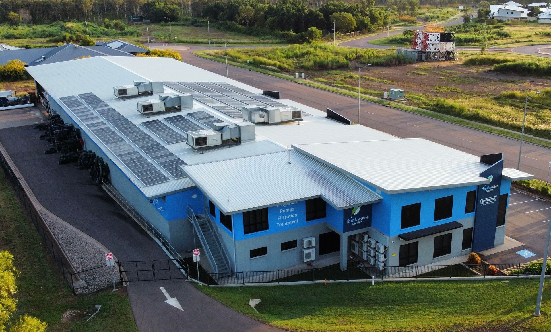 A Commercial Building With Solar Pannels On It— Inland Electrical in Humpty Doo, NT