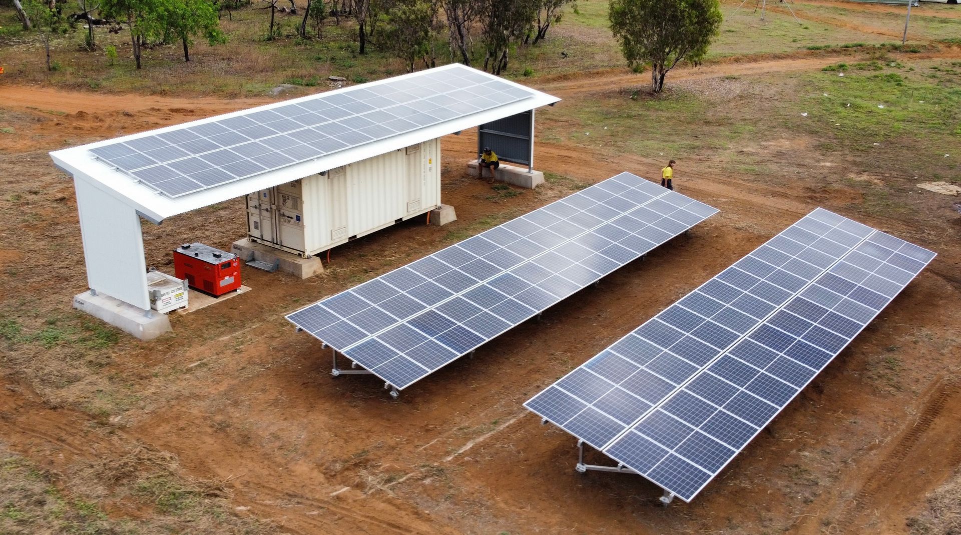 Solar Panels on The Ground and A White Roof — Inland Electrical in Humpty Doo, NT