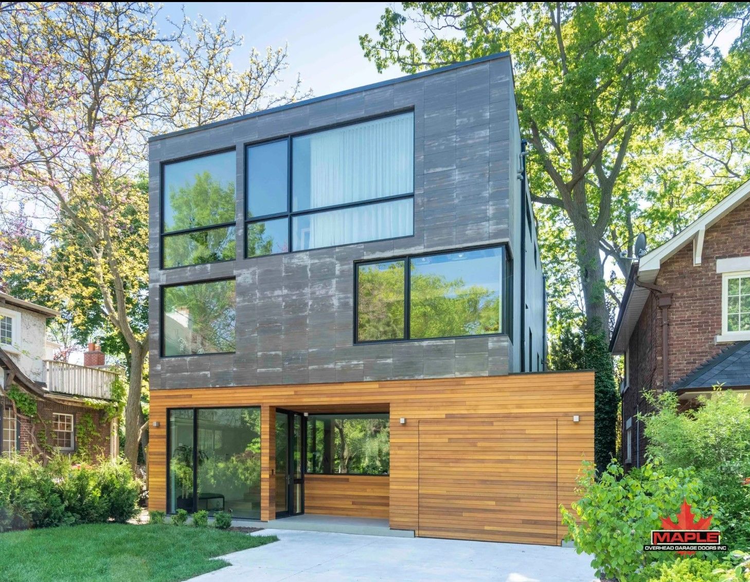 A modern house with a lot of windows is for sale