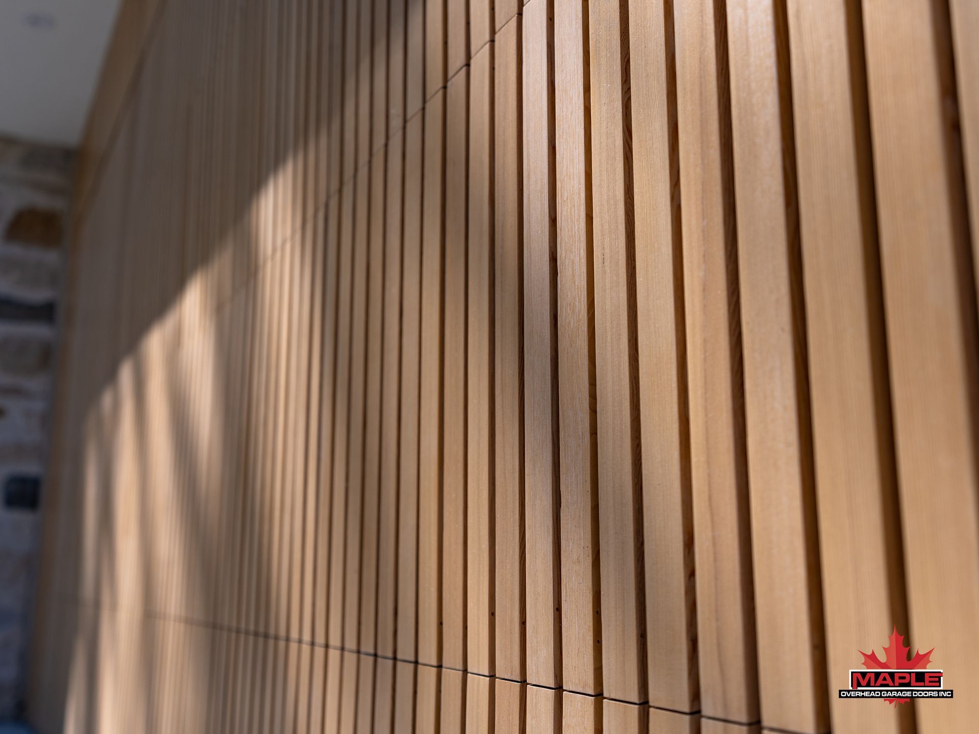 A wooden wall with a canadian logo on it