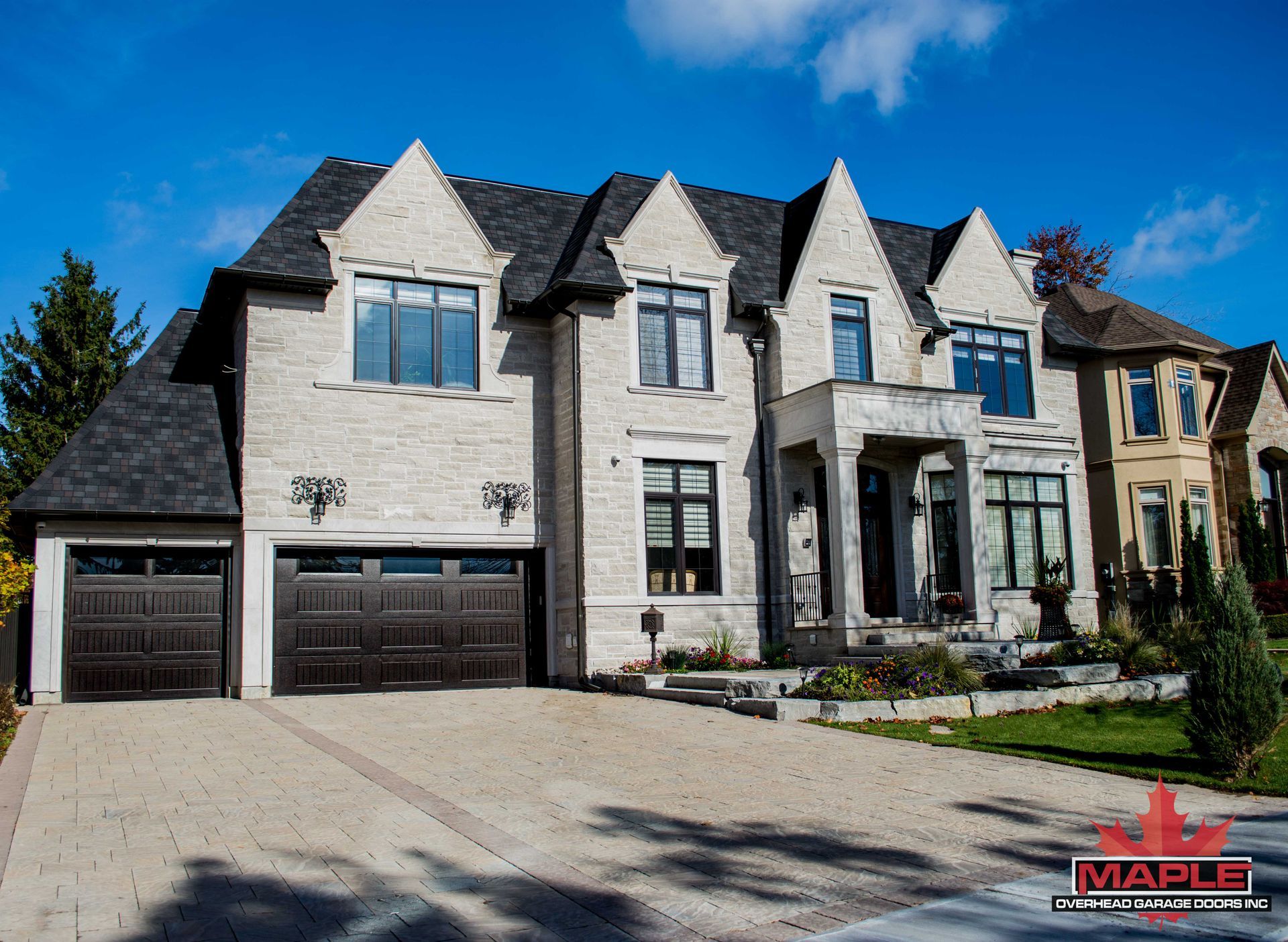 A large house with a maple logo on it