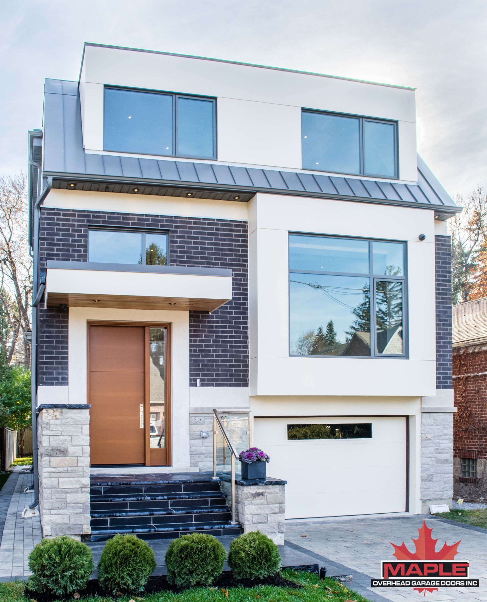 The front of a house with a maple leaf on it