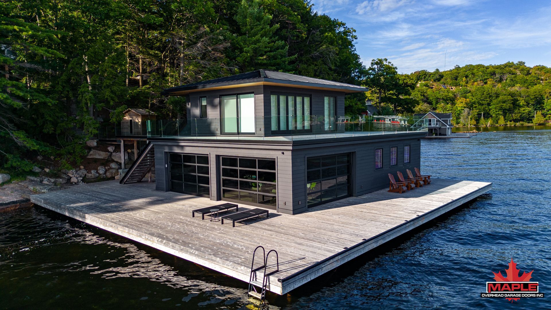 A house is sitting on top of a dock in the middle of a lake.