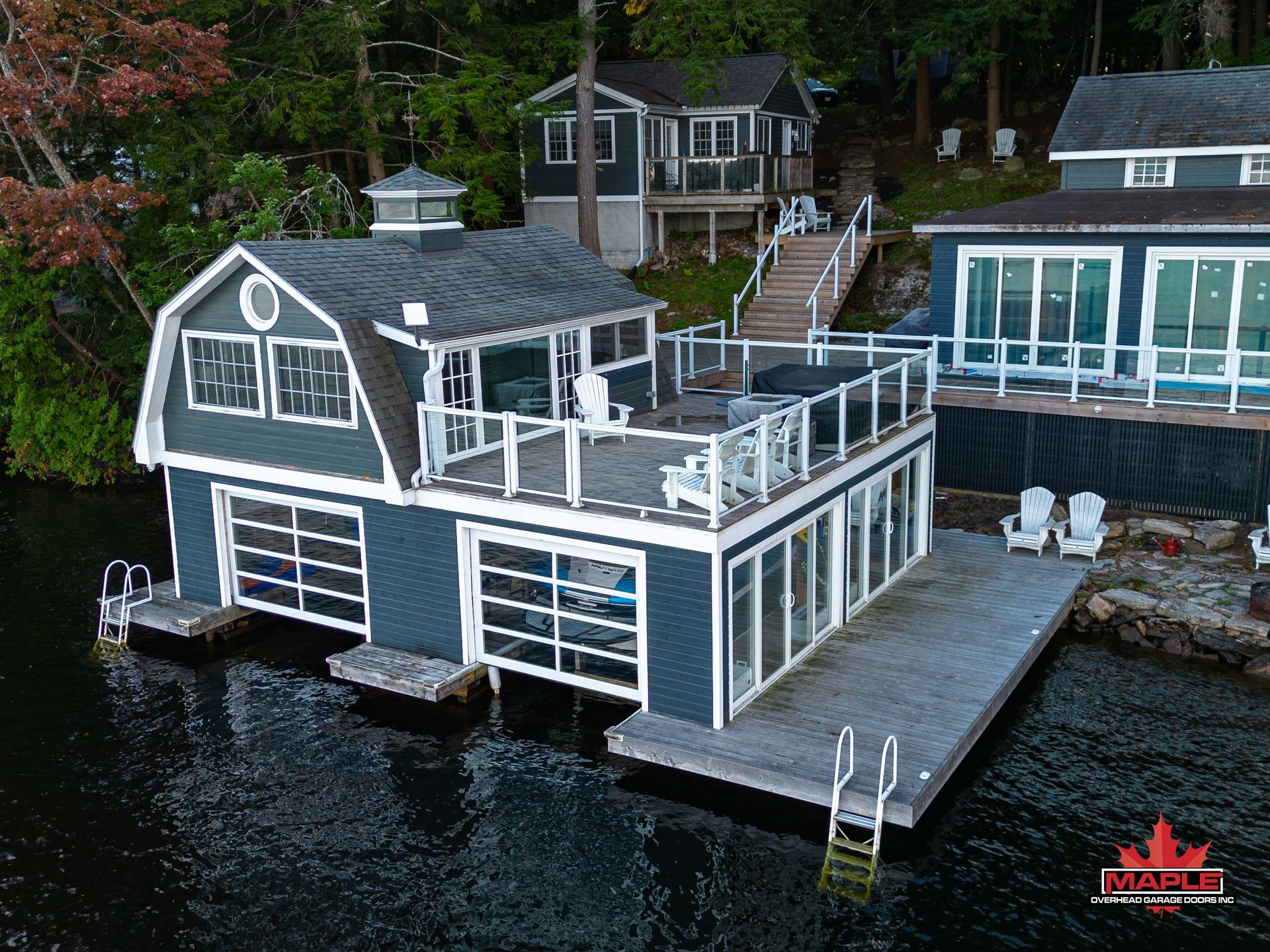 A large house is sitting on top of a large body of water.