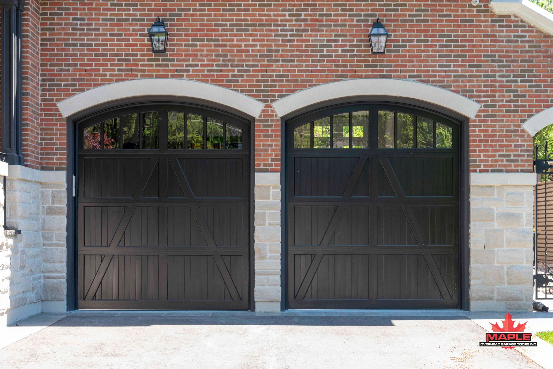A couple of garage doors on a brick building