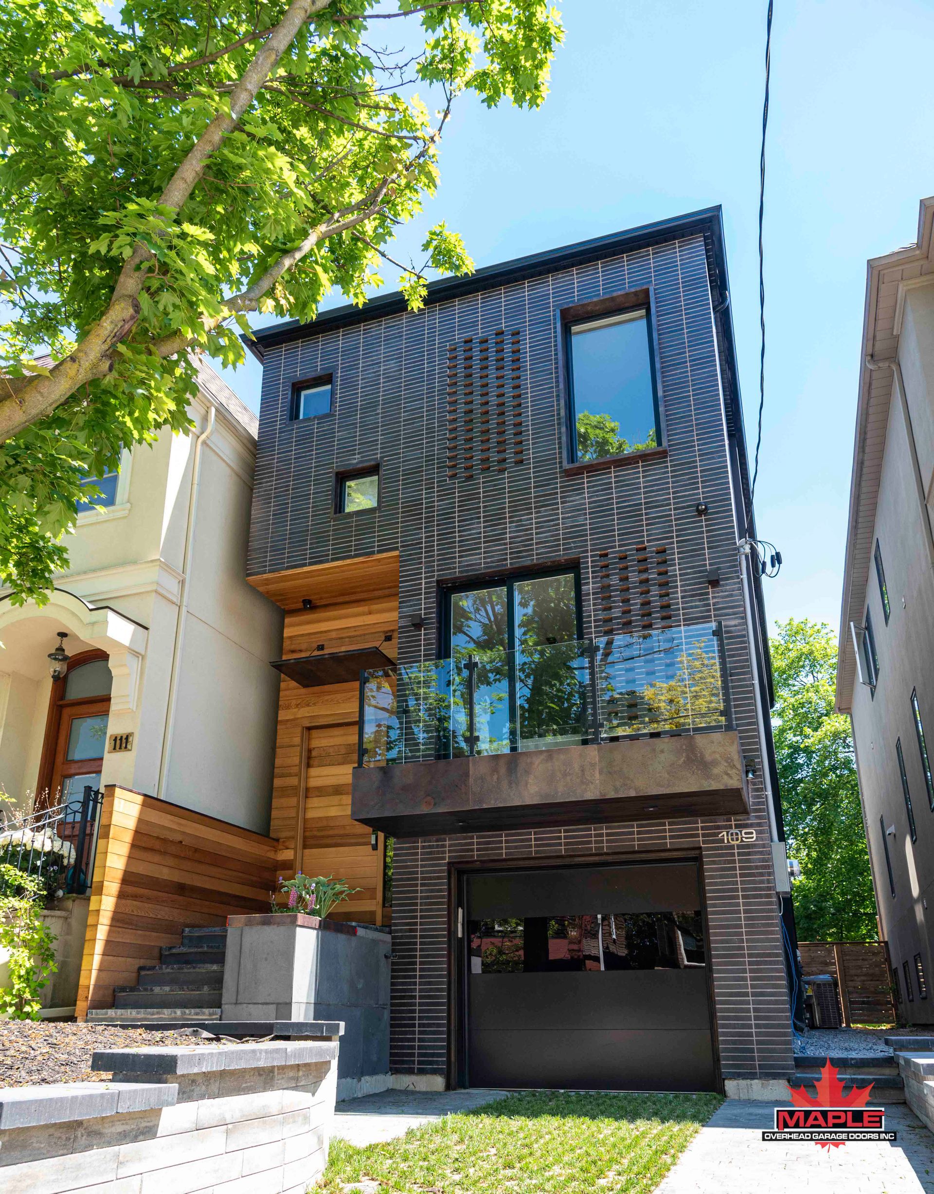 A modern house with a large garage and stairs