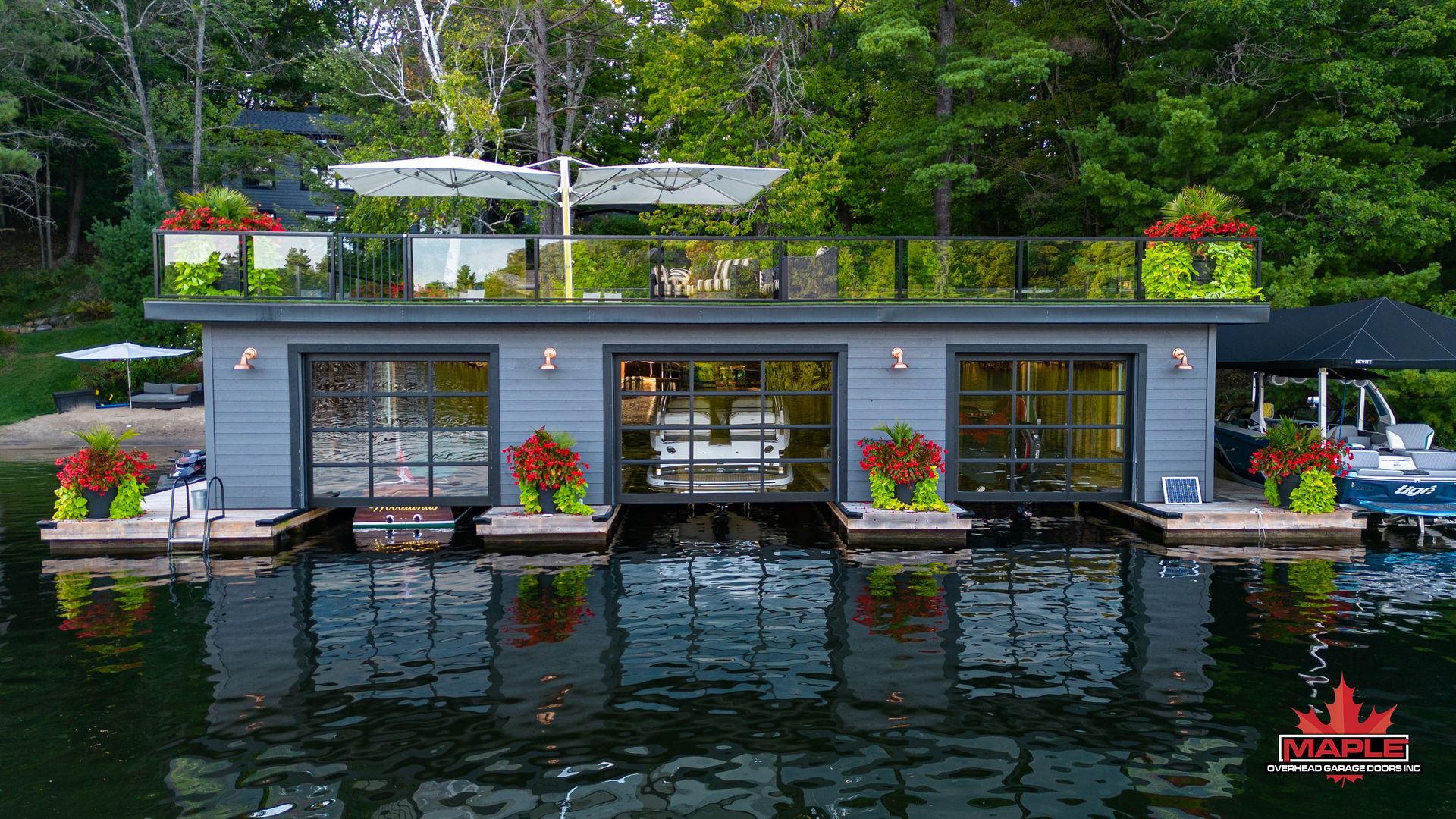 A boat house is floating on top of a lake.