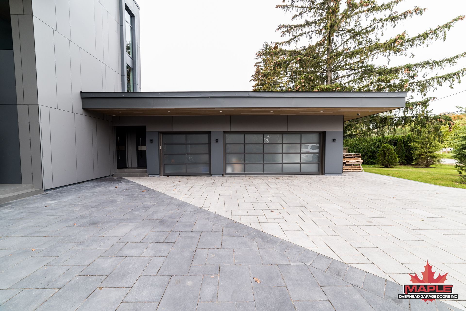 A large house with a canadian flag on the side of it