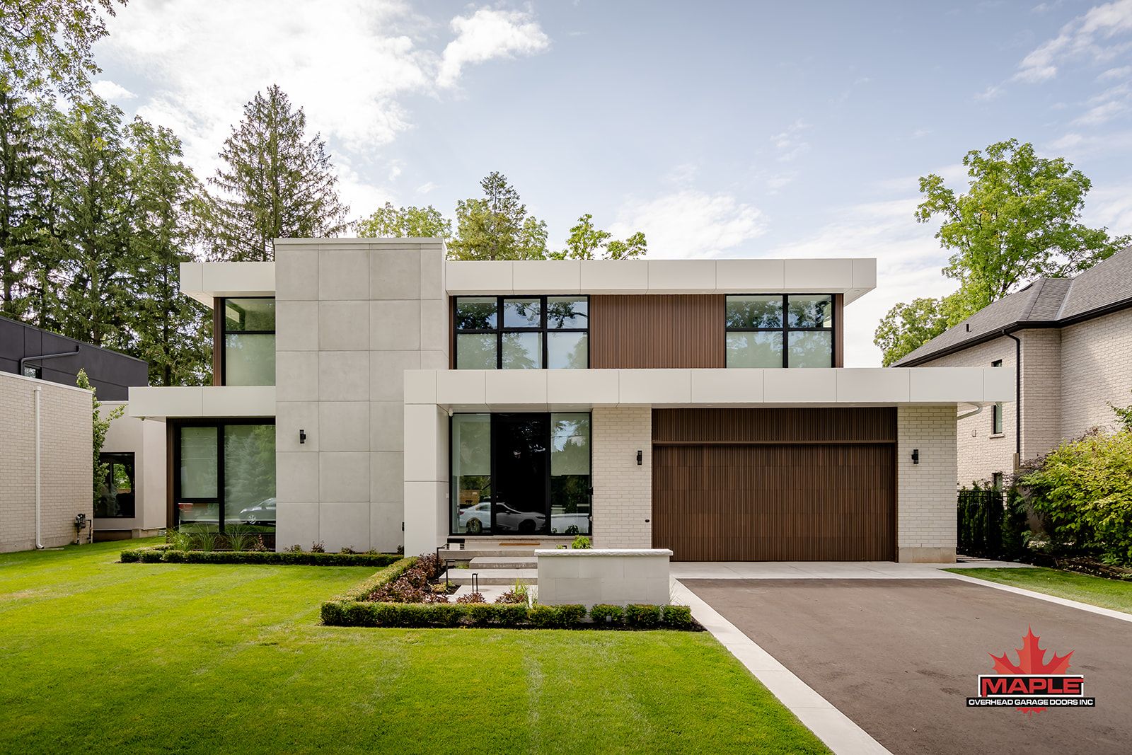 A modern white house with a wooden garage door