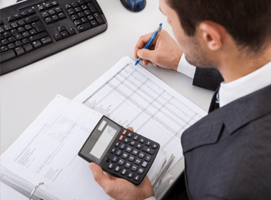 Successful accountant working with financial data in the office