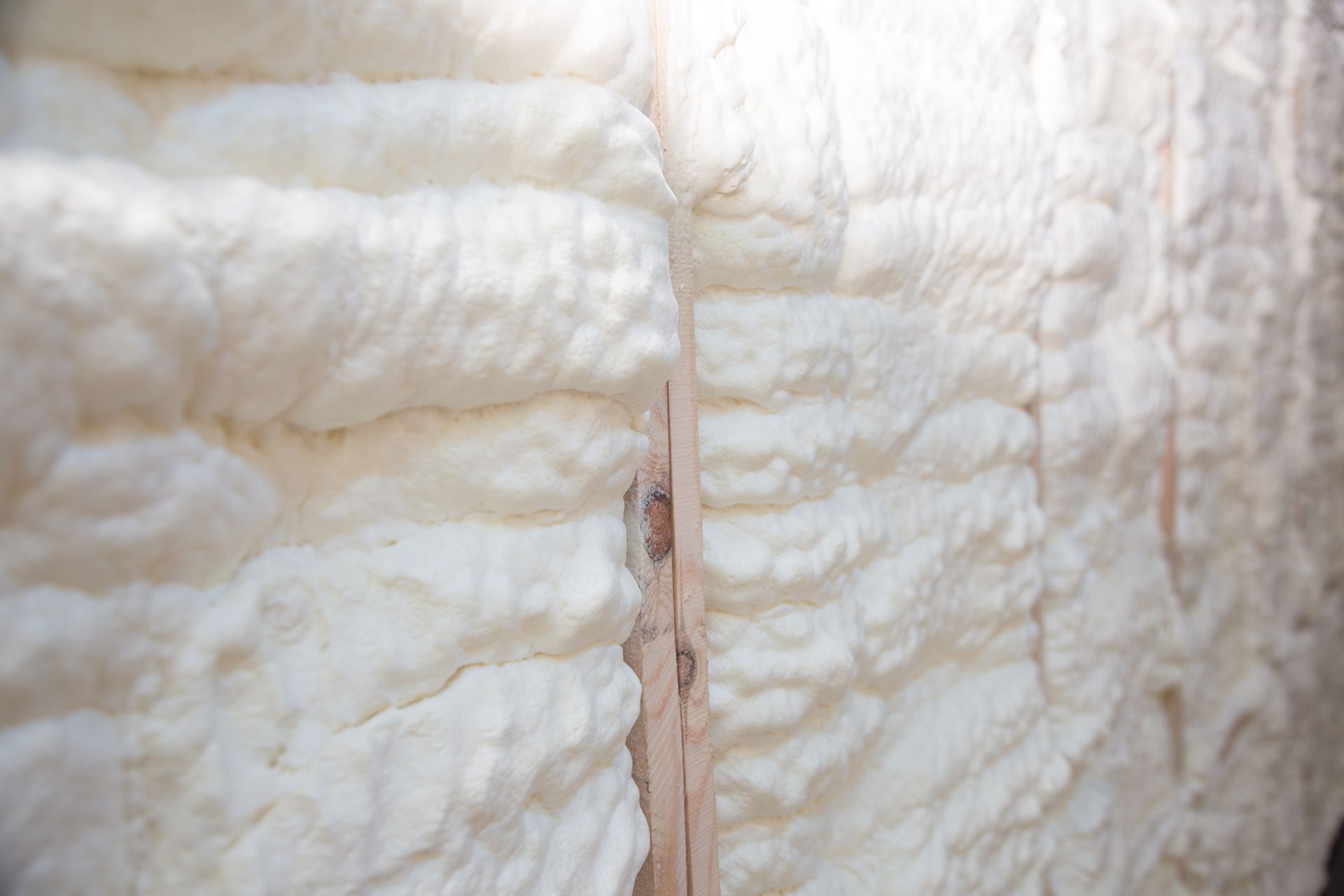 A close up of a wall covered in foam insulation.