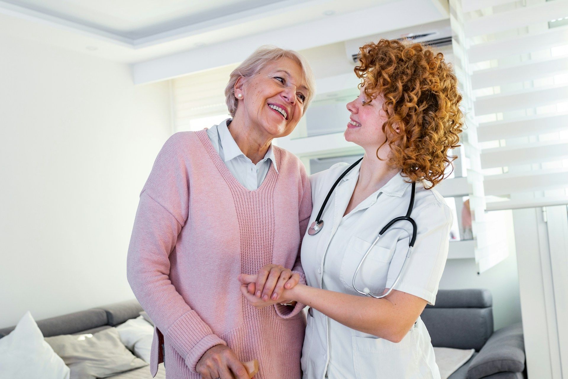 Family smiles inside a car, driving on a sunny day.