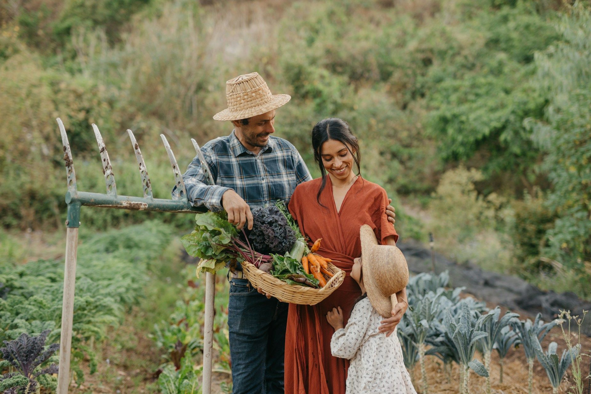 Woman in blue blazer, white shirt, stands on rooftop, city skyline background.