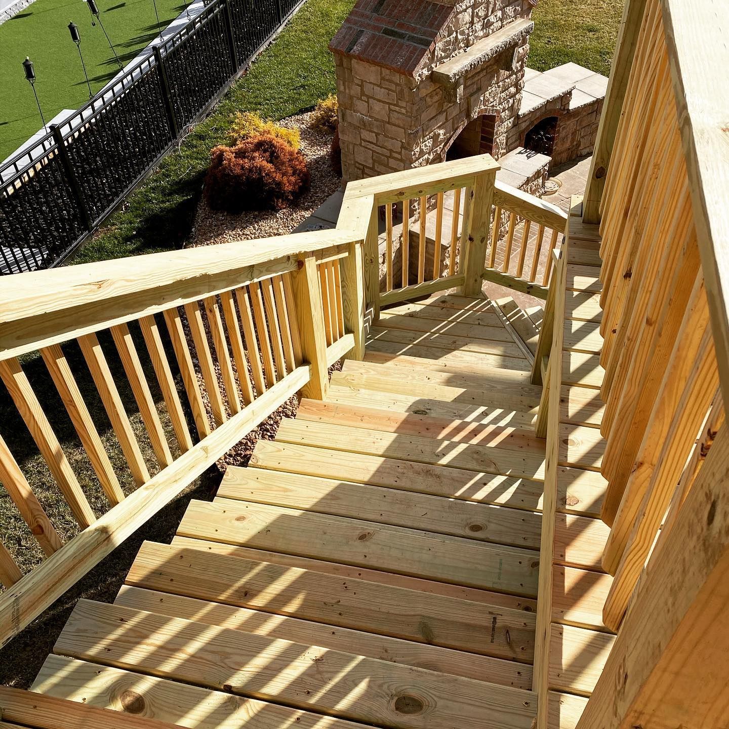 A wooden deck with stairs leading up to it