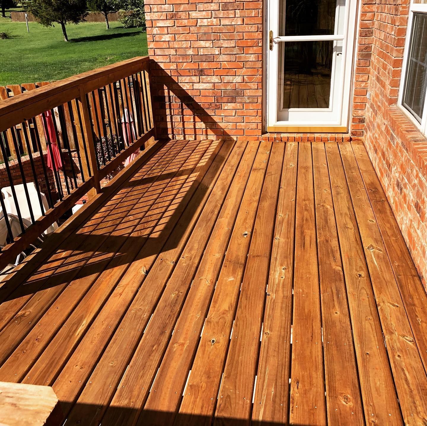 A wooden deck in a brick house