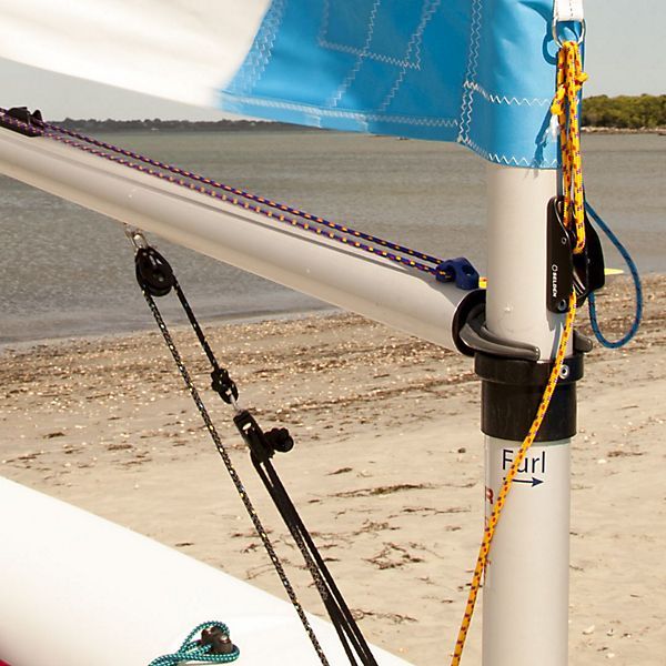 A sailboat on a beach with the word furl on the pole