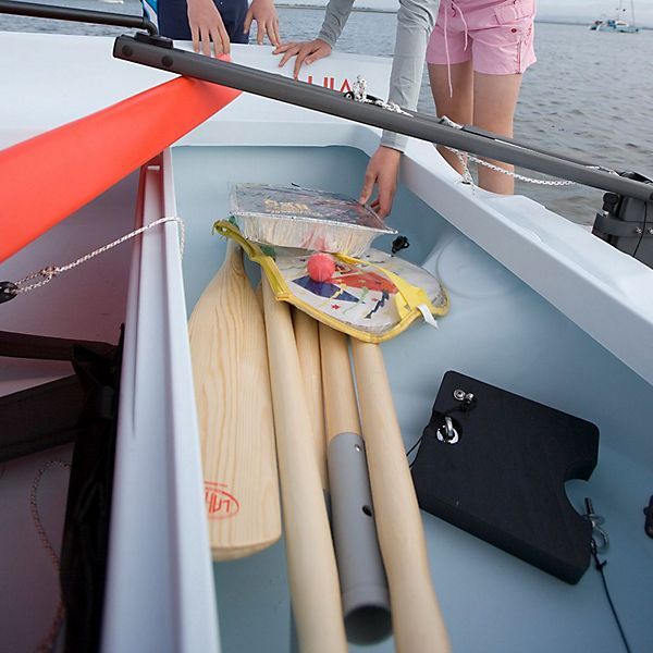 A boat with oars and a bag that says ' u.s. ' on it