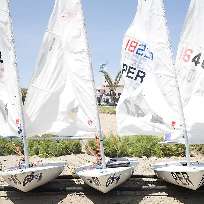 A row of sailboats with the number 1824 on the sail