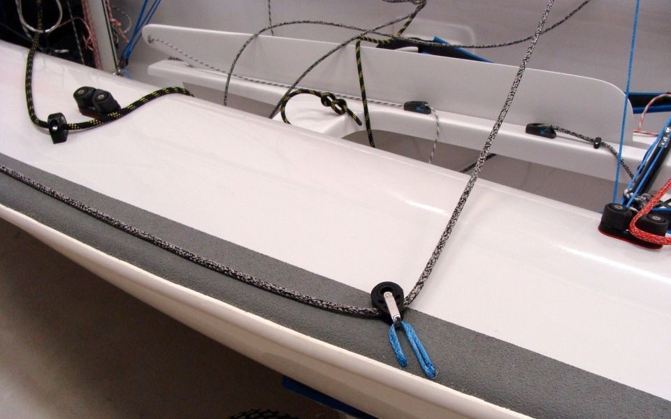 A close up of a boat with ropes attached to it