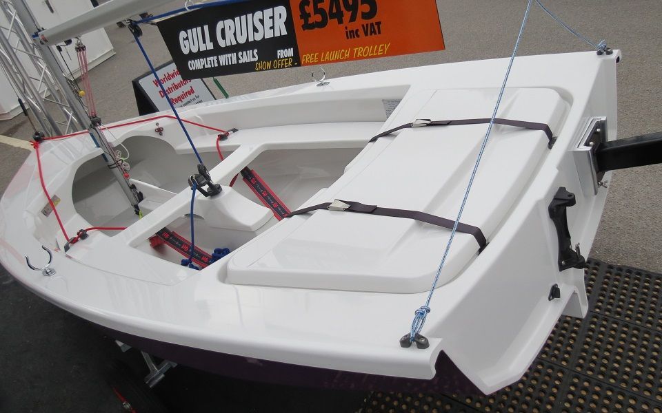 A sailboat with a sign that says gull cruiser on it