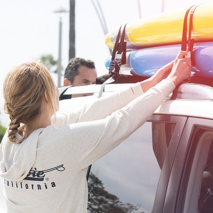 A woman wearing a hoodie that says california on the back