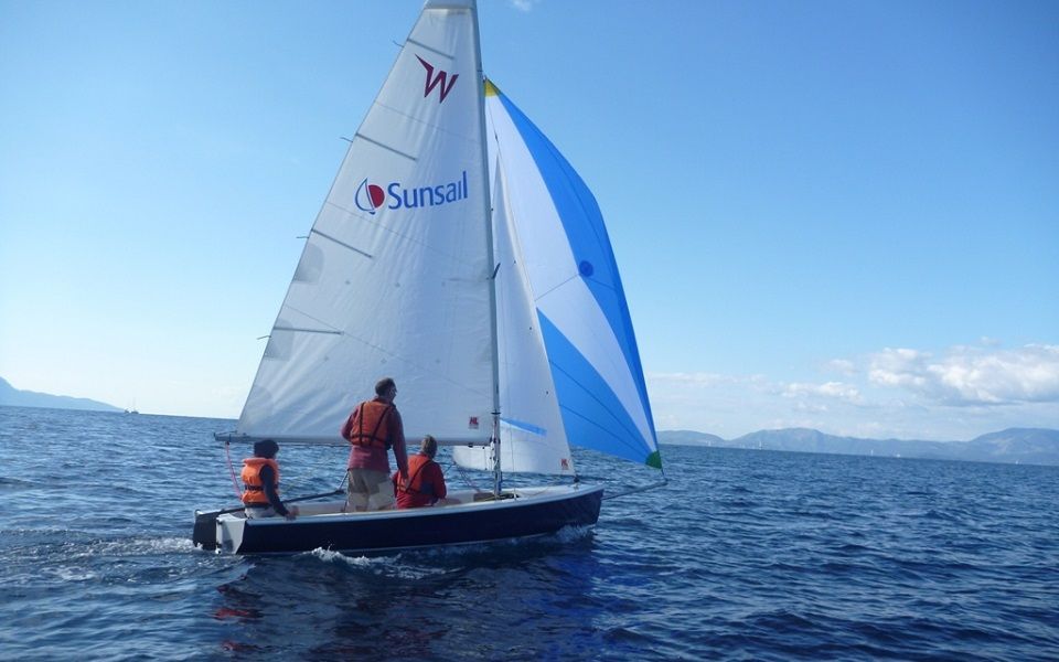 A sailboat with the word sunsail on the sail