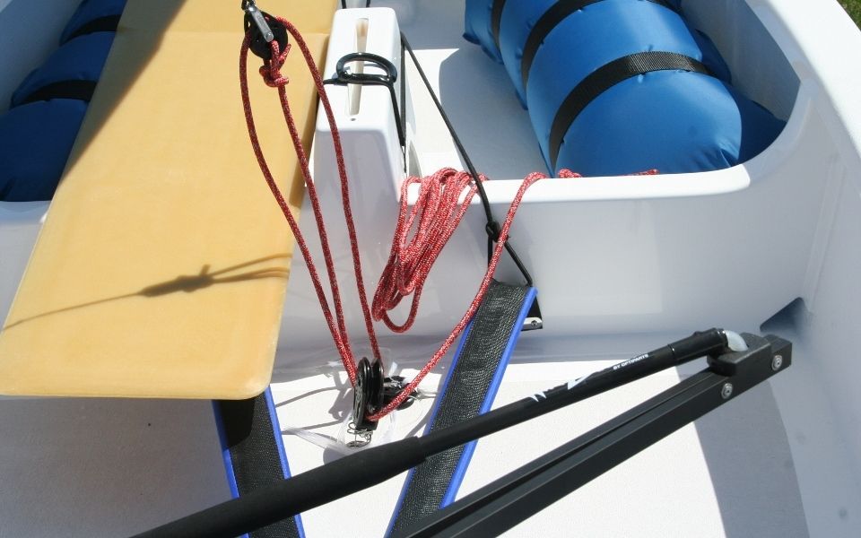 A boat with a blue life preserver in the back