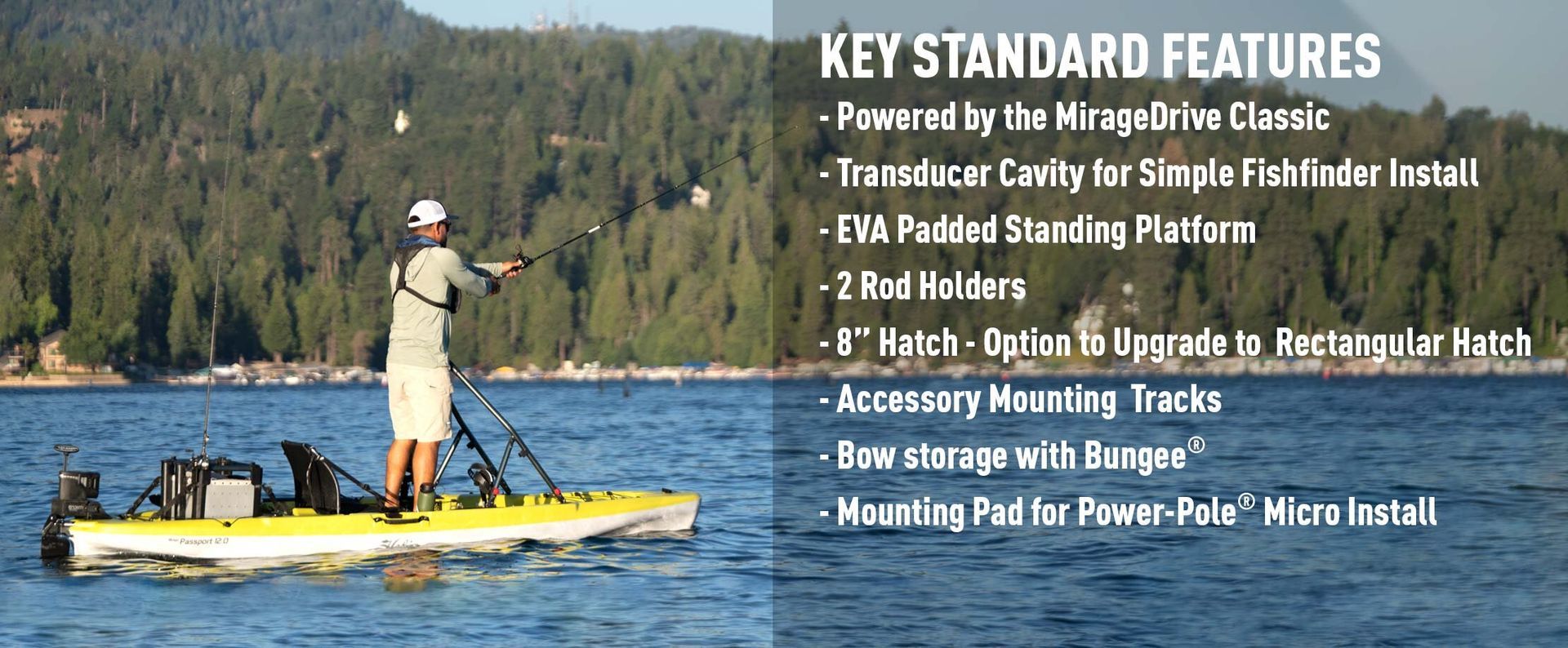 A man is fishing in a yellow kayak on a lake ..