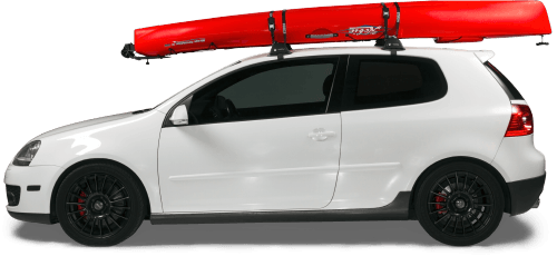 A white car with a red kayak on top of it