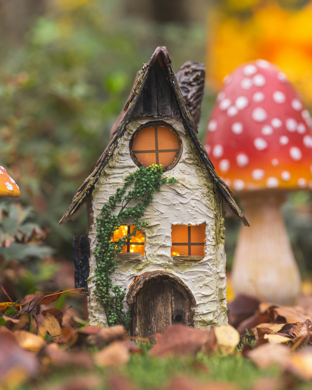 Easter Bunny character in a blue polka dot jacket standing in a daffodil patch