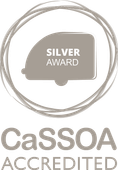 CaSSOA Accredited Silver Award logo: gray circle with trailer icon.