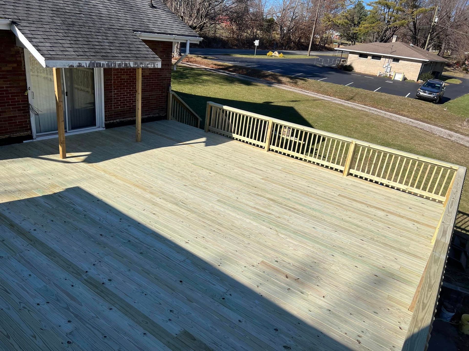 A Large Wooden Deck Is Being Built On Top Of A House - Princeton, IN - J. Koberstein Construction