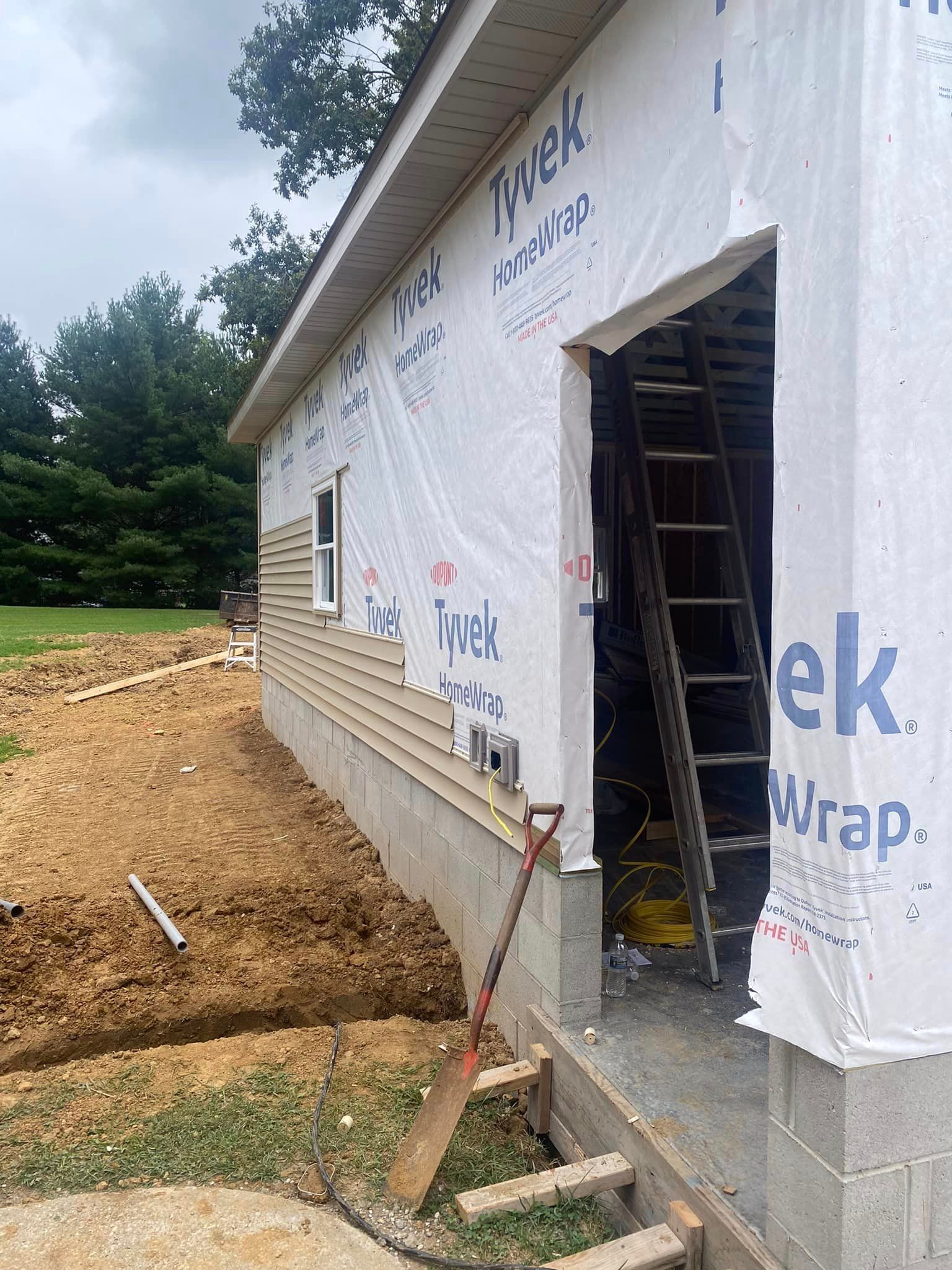 A Shovel Is Sitting On The Side Of A House Under Construction - Princeton, IN - J. Koberstein Construction