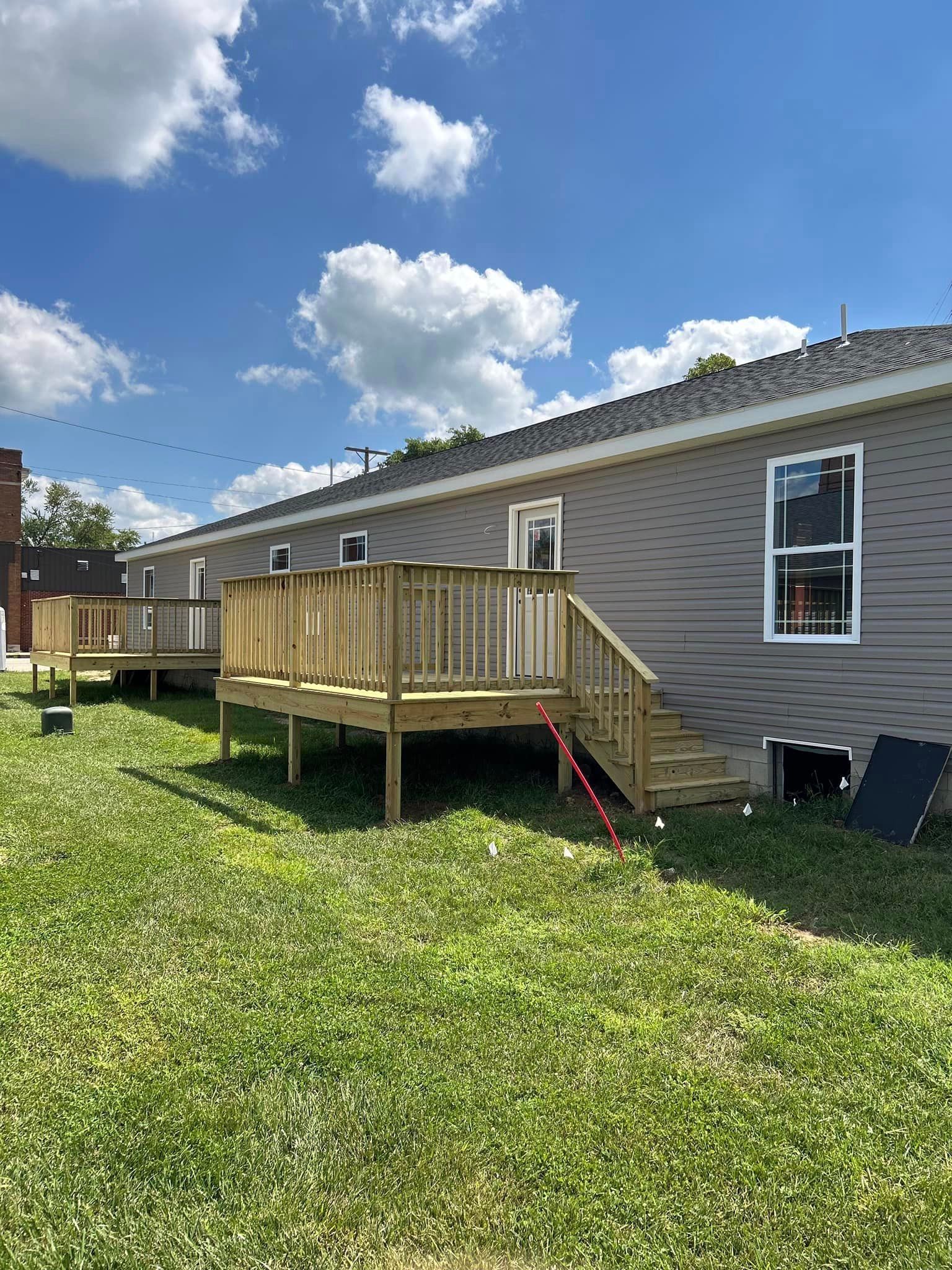A Home With A Wooden Deck In Front Of It - Princeton, IN - J. Koberstein Construction