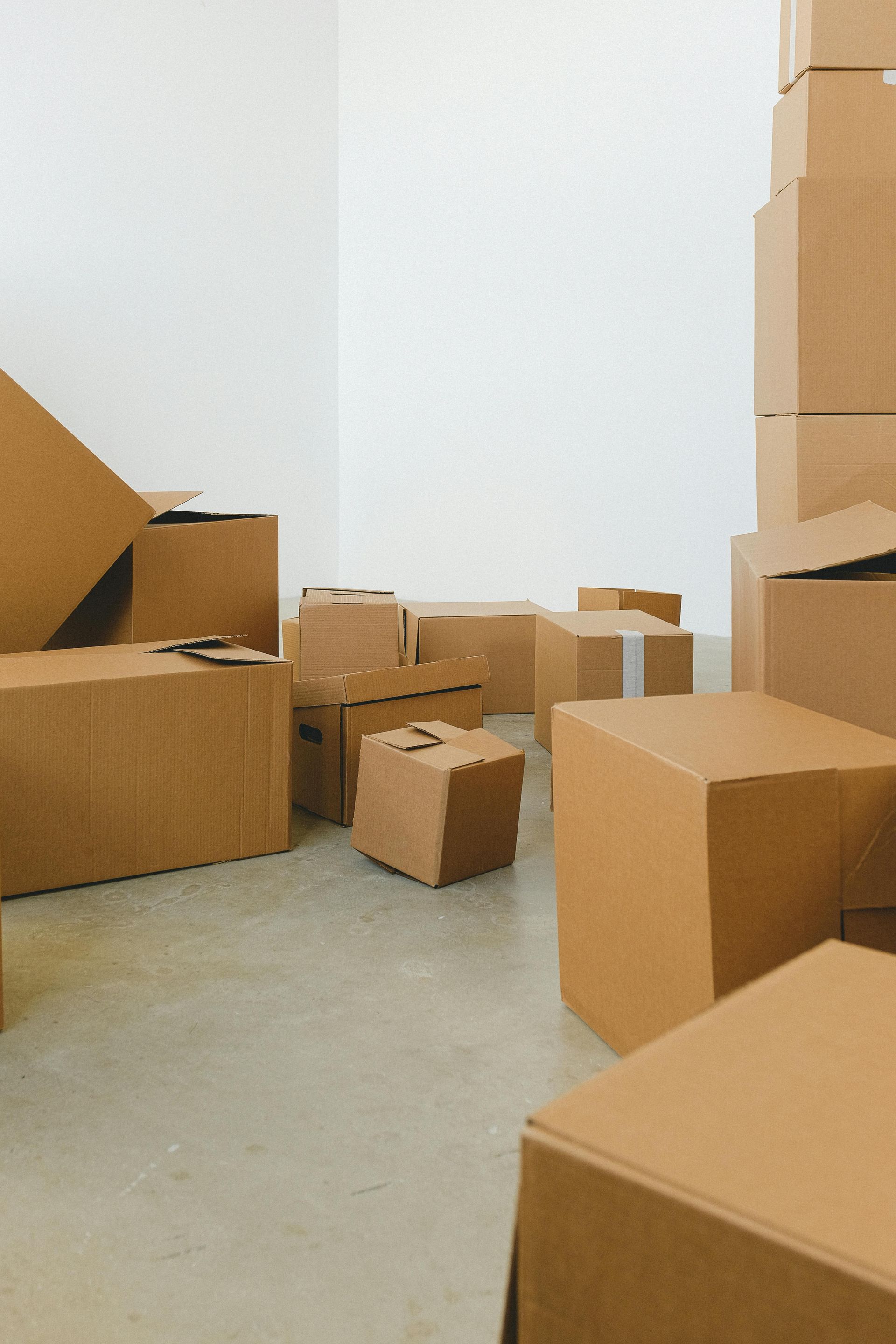 A room filled with lots of cardboard boxes stacked on top of each other.