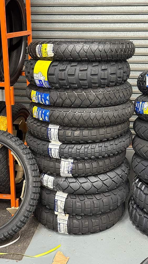 Stack of Black Motorcycle Tires With Chunky Tread — Newcastle Motorcycle Tyres in Broadmeadow, NSW